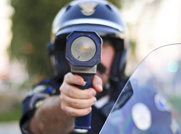 Officer holding a portable radar device